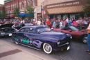 Low old black sedan with purple/green flames. (click to zoom)