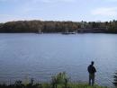 Saint Mary's: Lake, fisherman, distant gazebos (big image). (click to zoom)