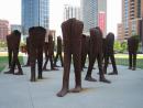Outdoor sculpture of crowd of walking legs. (click to zoom)