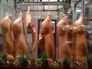 Dead Pigs hanging in a Lincoln Square window. (click to zoom)
