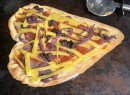 Heart Shaped Slivers Of Tuber Steamed with Shallots and Blueberries Sauteed Onions Vegan Cheddar Heart Shaped Crust
